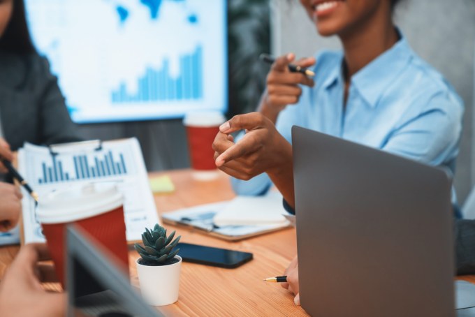 Multiracial analyst team use BI dashboard for data analysis. Concord